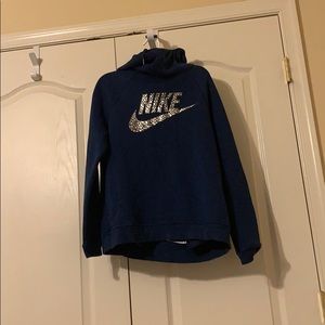 A dark blue cozy nike hoodie